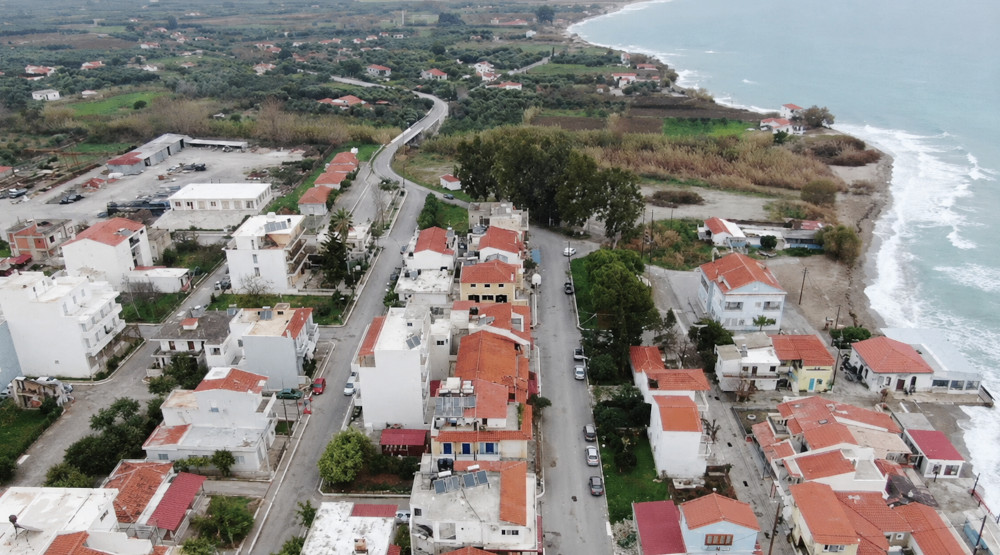 Seaside settlement of Ireon Samos with clear waters, boats and views of the Aegean