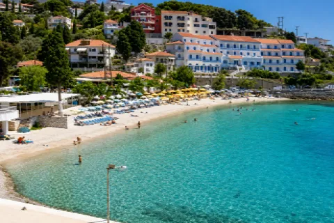 Gagkou Beach in Samos with calm water, sunbeds and cafés near Vathy