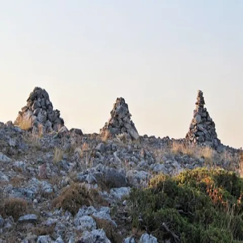 Ruins of Lazaros Castle on Mount Karvounis, surrounded by nature