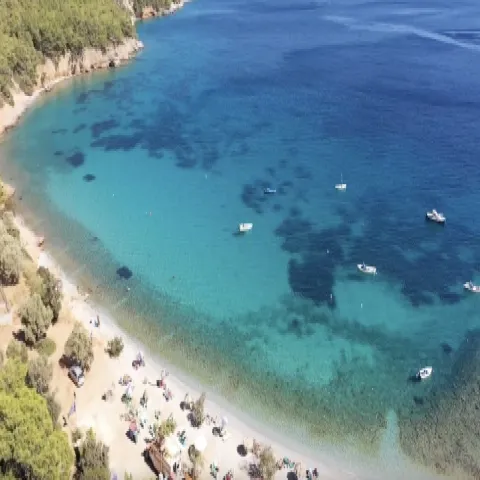 Mourtia Beach in Samos with pebbles, blue water and secluded natural beauty