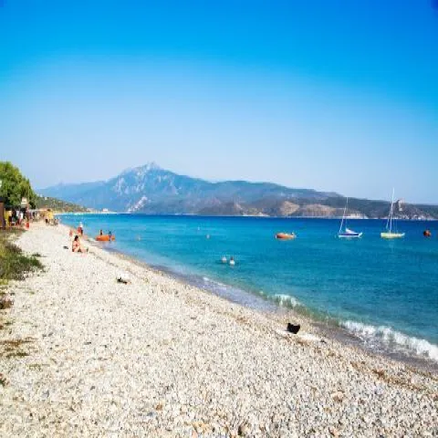 Mykali Beach in Samos with fine pebbles and views of Asia Minor
