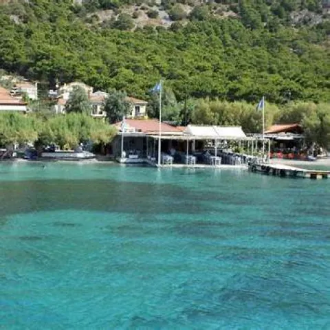 Poseidonio Bay in Samos with calm waters, seaside tavernas and views of Asia Minor