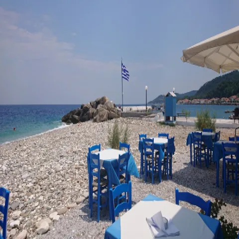 Agios Konstantinos Beach on Samos with a pebble shore and clear blue waters